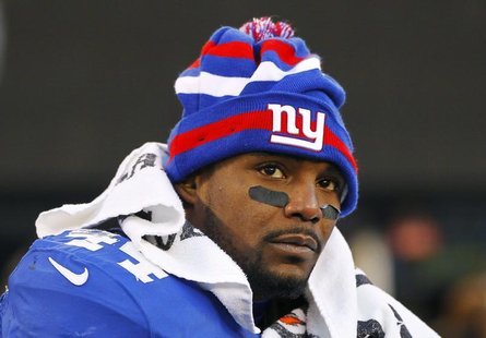 New York Giants' Ahmad Bradshaw sits on the bench in the final minutes of their NFL football game against the Philadelphia Eagles in East Ru New York Giants' Ahmad Bradshaw sits on the bench in the final minutes of their NFL football game against the Philadelphia Eagles in East Ru