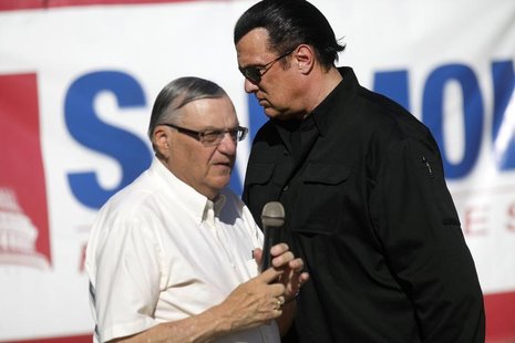 Maricopa County Sheriff Joe Arpaio (L) is introduced by actor Steven Seagal during a campaign rally in Mesa, Arizona October 27, 2012. REUTE Maricopa County Sheriff Joe Arpaio (L) is introduced by actor Steven Seagal during a campaign rally in Mesa, Arizona October 27, 2012. REUTE