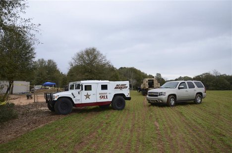 Authorities secure the residence of Jimmy Lee Dykes where a five-year-old boy was rescued after being held hostage for almost one week in an Authorities secure the residence of Jimmy Lee Dykes where a five-year-old boy was rescued after being held hostage for almost one week in an