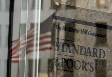 A U.S. flag is reflected in a window of the Standard and Poor's building in New York February 5, 2013. REUTERS/Brendan McDermid A U.S. flag is reflected in a window of the Standard and Poor's building in New York February 5, 2013. REUTERS/Brendan McDermid