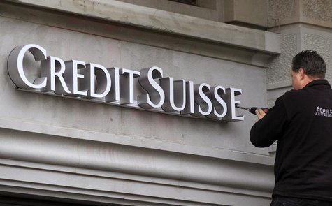 A worker uses a cordless screwdriver to fix the logo of Swiss bank Credit Suisse at a branch office in Zurich February 4, 2013. REUTERS/Arnd A worker uses a cordless screwdriver to fix the logo of Swiss bank Credit Suisse at a branch office in Zurich February 4, 2013. REUTERS/Arnd