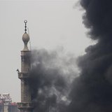 Smoke comes out from a mosque tower during heavy fighting between the Free Syrian Army and President Bashar al-Assad's forces, in the Jobar 
