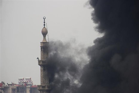 Smoke comes out from a mosque tower during heavy fighting between the Free Syrian Army and President Bashar al-Assad's forces, in the Jobar Smoke comes out from a mosque tower during heavy fighting between the Free Syrian Army and President Bashar al-Assad's forces, in the Jobar