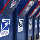 A view shows U.S. postal service mail boxes at a post office in Encinitas, California February 6, 2013. REUTERS/Mike Blake