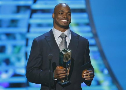 Minnesota Vikings running back Adrian Peterson accepts the NFL MVP award during the NFL Honors awards show in New Orleans, Louisiana Februar Minnesota Vikings running back Adrian Peterson accepts the NFL MVP award during the NFL Honors awards show in New Orleans, Louisiana Februar