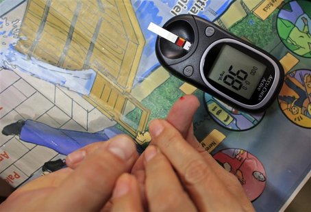 Diabetes educator Cornelia Cristofor teaches how to perform a blood sugar test at the Nicolae Paulescu National Institute for Diabetes, Nutr Diabetes educator Cornelia Cristofor teaches how to perform a blood sugar test at the Nicolae Paulescu National Institute for Diabetes, Nutr