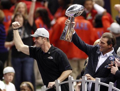 Baltimore Ravens head coach John Harbaugh (L) celebrates as team owner Steve Bisciotti holds up the Vince Lombardi Trophy after defeating th Baltimore Ravens head coach John Harbaugh (L) celebrates as team owner Steve Bisciotti holds up the Vince Lombardi Trophy after defeating th