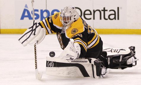 Boston Bruins goalie Tim Thomas makes a save against the Washington Capitals during the third period in Game 7 of their NHL Eastern Conferen Boston Bruins goalie Tim Thomas makes a save against the Washington Capitals during the third period in Game 7 of their NHL Eastern Conferen