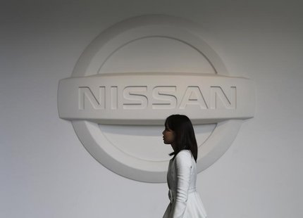 A woman walks past the logo of Nissan Motor Co at the company's showroom in Yokohama, south of Tokyo February 8, 2013. REUTERS/Toru Hanai A woman walks past the logo of Nissan Motor Co at the company's showroom in Yokohama, south of Tokyo February 8, 2013. REUTERS/Toru Hanai