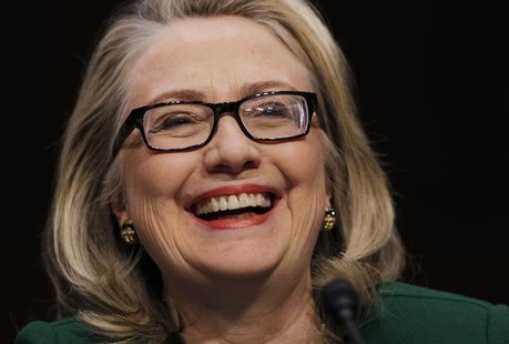 U.S.Secretary of State Hillary Clinton sits down to testify on the September attack on U.S. diplomatic sites in Benghazi, Libya during a hea U.S.Secretary of State Hillary Clinton sits down to testify on the September attack on U.S. diplomatic sites in Benghazi, Libya during a hea