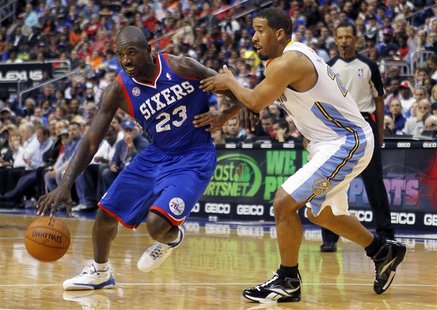 Philadelphia 76ers guard Jason Richardson (23) drives on the Denver Nuggets guard Andre Miller (R) during the second half of their NBA baske Philadelphia 76ers guard Jason Richardson (23) drives on the Denver Nuggets guard Andre Miller (R) during the second half of their NBA baske