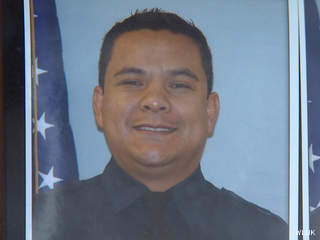 A photo of Fond du Lac firefighter/paramedic Edgar Ramirez-Tellez is seen on the wall at the fire department, Jan. 16, 2013. (courtesy of FOX 11). A photo of Fond du Lac firefighter/paramedic Edgar Ramirez-Tellez is seen on the wall at the fire department, Jan. 16, 2013. (courtesy of FOX 11).