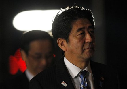 Japan's Prime Minister Shinzo Abe (R) arrives at his official residence for attending an advisory panel on restructuring legal infrastructur Japan's Prime Minister Shinzo Abe (R) arrives at his official residence for attending an advisory panel on restructuring legal infrastructur