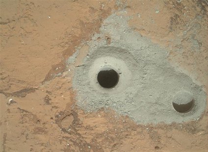 At the center of this image released to Reuters on February 9, 2013 from NASA's Curiosity rover is the hole in a rock called "John Klein" wh At the center of this image released to Reuters on February 9, 2013 from NASA's Curiosity rover is the hole in a rock called "John Klein" wh