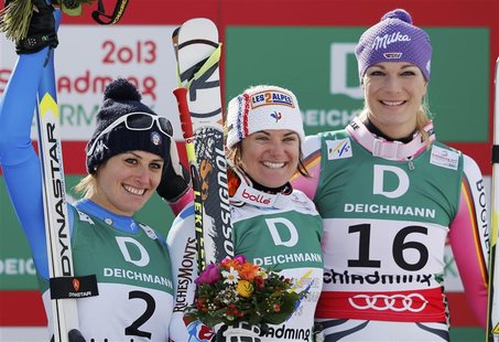 Second placed Nadia Fanchini of Italy (L), first placed Marion Rolland of France (C) and third placed Maria Hoefl-Riesch of Germany celebrat Second placed Nadia Fanchini of Italy (L), first placed Marion Rolland of France (C) and third placed Maria Hoefl-Riesch of Germany celebrat