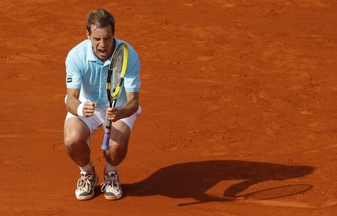 Richard Gasquet of France reacts during his match against Tommy Haas of Germany during the French Open tennis tournament at the Roland Garro Richard Gasquet of France reacts during his match against Tommy Haas of Germany during the French Open tennis tournament at the Roland Garro
