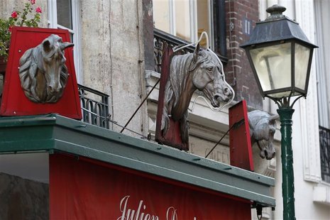 Metal horse heads are seen above a closed horsemeat butcher shop in Paris January 16, 2013. REUTERS/Charles Platiau (FRANCE - Tags: BUSINESS Metal horse heads are seen above a closed horsemeat butcher shop in Paris January 16, 2013. REUTERS/Charles Platiau (FRANCE - Tags: BUSINESS