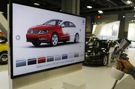 A unique Volkswagen consumer interactive display that allows potential buyers to spray paint different models in different colors is seen at A unique Volkswagen consumer interactive display that allows potential buyers to spray paint different models in different colors is seen at