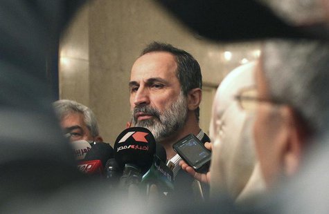 Syrian National Coalition leader Moaz Alkhatib speaks to the media after meeting with Arab League head Nabil al-Arabi in Cairo February 11, Syrian National Coalition leader Moaz Alkhatib speaks to the media after meeting with Arab League head Nabil al-Arabi in Cairo February 11,