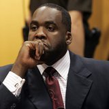 Former Detroit Mayor Kwame Kilpatrick sits in a Wayne County Circuit Court room during a bond hearing to request removal of his court ordere Former Detroit Mayor Kwame Kilpatrick sits in a Wayne County Circuit Court room during a bond hearing to request removal of his court ordere