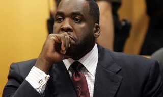 Former Detroit Mayor Kwame Kilpatrick sits in a Wayne County Circuit Court room during a bond hearing to request removal of his court ordere Former Detroit Mayor Kwame Kilpatrick sits in a Wayne County Circuit Court room during a bond hearing to request removal of his court ordere