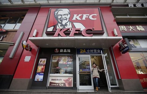 A woman walks out from a KFC restaurant as she speaks on her mobile phone in Wuhan, Hubei province, February 5, 2013. REUTERS/Stringer A woman walks out from a KFC restaurant as she speaks on her mobile phone in Wuhan, Hubei province, February 5, 2013. REUTERS/Stringer