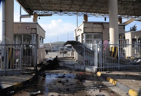 A man walks past a damaged gate after an explosion at Cilvegozu border gate on the Turkish-Syrian border in Hatay province February 11, 2013 A man walks past a damaged gate after an explosion at Cilvegozu border gate on the Turkish-Syrian border in Hatay province February 11, 2013