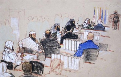 (L-R, wearing camouflage) Ramzi, Walid bin Attash and Khalid Sheikh Mohammad, three of the alleged conspirators in the 9/11 attacks, attend (L-R, wearing camouflage) Ramzi, Walid bin Attash and Khalid Sheikh Mohammad, three of the alleged conspirators in the 9/11 attacks, attend