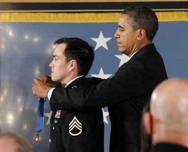 U.S. President Barack Obama awards the Medal of Honor to former active duty Army Staff Segeant Clinton Romesha during a ceremony in the East U.S. President Barack Obama awards the Medal of Honor to former active duty Army Staff Segeant Clinton Romesha during a ceremony in the East