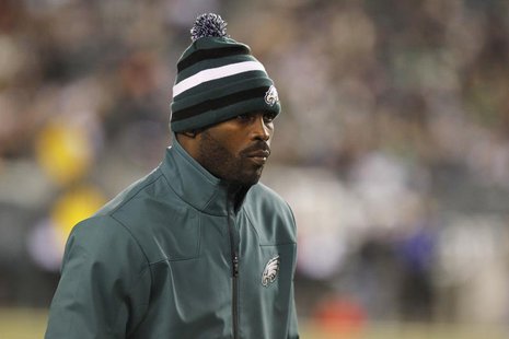 Philadelphia Eagles quarterback Michael Vick watches from the sidelines during their NFL football game against the Carolina Panthers in Phil Philadelphia Eagles quarterback Michael Vick watches from the sidelines during their NFL football game against the Carolina Panthers in Phil