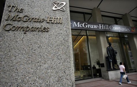 A woman walks past the entrance to offices of the McGraw-Hill Companies, in New York August 15, 2008. REUTERS/Brendan McDermid A woman walks past the entrance to offices of the McGraw-Hill Companies, in New York August 15, 2008. REUTERS/Brendan McDermid