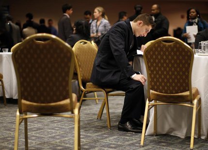 A job seeker fills out forms at a table while attending a career fair with prospective employers in New York City, October 24, 2012. REUTERS A job seeker fills out forms at a table while attending a career fair with prospective employers in New York City, October 24, 2012. REUTERS