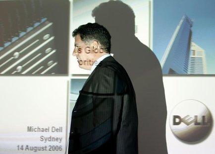 Founder and chairman of Dell computers Michael Dell passes a screen projection before speaking at a news conference in Sydney August 14, 200 Founder and chairman of Dell computers Michael Dell passes a screen projection before speaking at a news conference in Sydney August 14, 200
