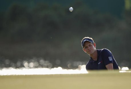 Luke Donald of Britain hits out of a bunker on the 17th hole during the final round of the DP World Tour Championship at Jumeirah Golf Estat Luke Donald of Britain hits out of a bunker on the 17th hole during the final round of the DP World Tour Championship at Jumeirah Golf Estat