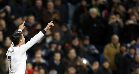 Real Madrid's Cristiano Ronaldo celebrates after scoring his third goal against Sevilla during their Spanish first division soccer match at Real Madrid's Cristiano Ronaldo celebrates after scoring his third goal against Sevilla during their Spanish first division soccer match at