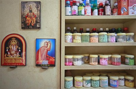 Pictures of Hindu gods hang beside a medicine rack inside a clinic in Pune in this August 27, 2012 file photo. REUTERS/Danish Siddiqui/Files Pictures of Hindu gods hang beside a medicine rack inside a clinic in Pune in this August 27, 2012 file photo. REUTERS/Danish Siddiqui/Files