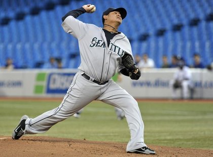 Seattle Mariners pitcher Felix Hernandez throws against the Toronto Blue Jays during the first inning of their MLB American League baseball Seattle Mariners pitcher Felix Hernandez throws against the Toronto Blue Jays during the first inning of their MLB American League baseball