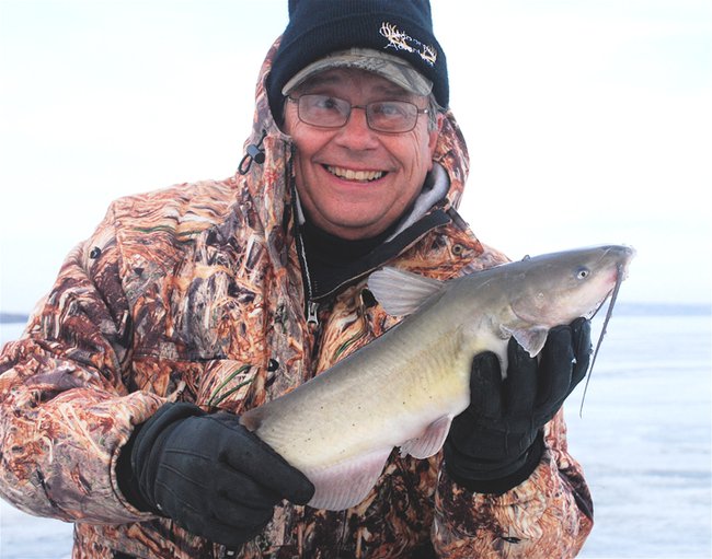 Outdoorsmen Adventures TV team member Larry Myhre holding one of his many channel catfish caught on Lake Oahe