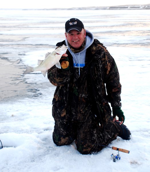 Outdoorsmen Adventures TV host Gary Howey with a white bass caught on Lake Oahe.