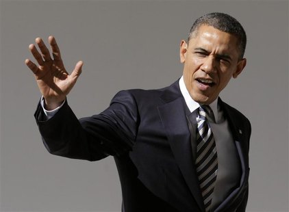 U.S. President Barack Obama waves to reporters as he walks through the colonnade of the White House in Washington February 12, 2013. REUTERS U.S. President Barack Obama waves to reporters as he walks through the colonnade of the White House in Washington February 12, 2013. REUTERS