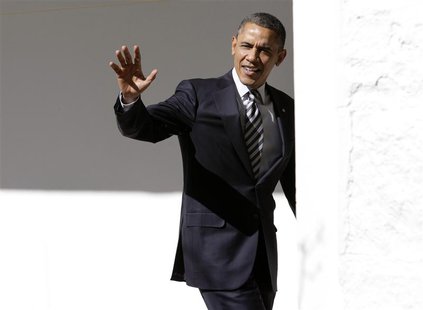 U.S. President Barack Obama waves to reporters as he walks through the colonnade of the White House in Washington February 12, 2013. REUTERS U.S. President Barack Obama waves to reporters as he walks through the colonnade of the White House in Washington February 12, 2013. REUTERS