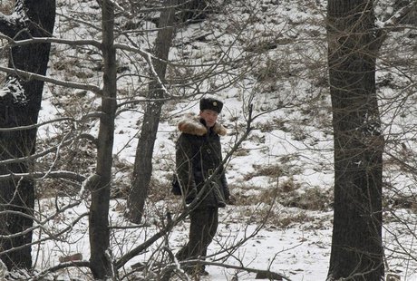 A North Korean soldier walks along the banks of Yalu River, near the North Korean town of Sinuiju, opposite the Chinese border city of Dando A North Korean soldier walks along the banks of Yalu River, near the North Korean town of Sinuiju, opposite the Chinese border city of Dando