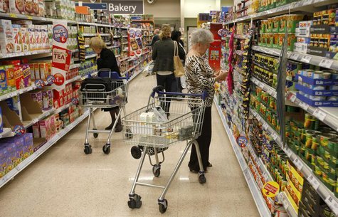 Customers shop for groceries in a supermarket in London October 18, 2011. REUTERS/Neil Hall Customers shop for groceries in a supermarket in London October 18, 2011. REUTERS/Neil Hall