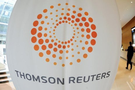 A man walks near a Thomson Reuters logo at the Thomson Reuters building in Canary Wharf in east London May 7, 2009. REUTERS/Toby Melville A man walks near a Thomson Reuters logo at the Thomson Reuters building in Canary Wharf in east London May 7, 2009. REUTERS/Toby Melville