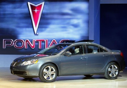 The Pontiac G6 is unveiled January 5, 2004 during press days at the North American International Auto Show in Detroit, MI. REUTERS/Gregory S The Pontiac G6 is unveiled January 5, 2004 during press days at the North American International Auto Show in Detroit, MI. REUTERS/Gregory S