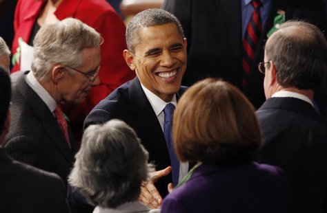 U.S. President Barack Obama talks with members of Congress as Senate Majority Leader Harry Reid (D-NV) (L) departs with him at the conclusio U.S. President Barack Obama talks with members of Congress as Senate Majority Leader Harry Reid (D-NV) (L) departs with him at the conclusio