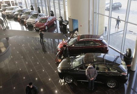 People visit a Lexus cars sales and show room in Krasnoyarsk, February 6, 2013. REUTERS/Ilya Naymushin People visit a Lexus cars sales and show room in Krasnoyarsk, February 6, 2013. REUTERS/Ilya Naymushin