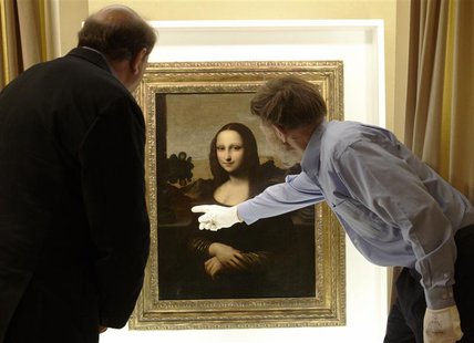 David Feldman (R) , vice president of the Mona Lisa Foundation, shows similarities on a painting attributed to Leonardo da Vinci and depicti David Feldman (R) , vice president of the Mona Lisa Foundation, shows similarities on a painting attributed to Leonardo da Vinci and depicti