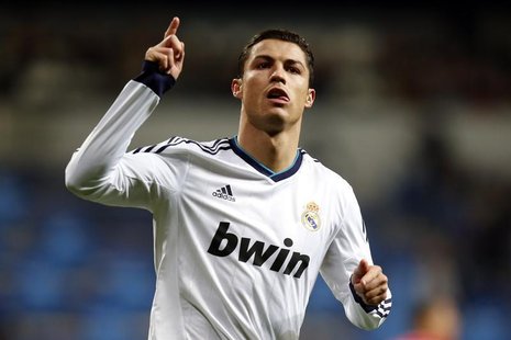 Real Madrid's Cristiano Ronaldo celebrates after scoring his second goal against Sevilla during their Spanish first division soccer match at Real Madrid's Cristiano Ronaldo celebrates after scoring his second goal against Sevilla during their Spanish first division soccer match at