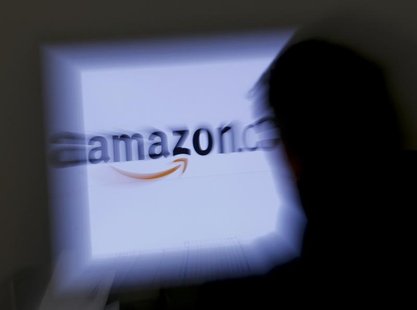 A zoomed illustration image of a man looking at a computer monitor showing the logo of Amazon is seen in Vienna November 26, 2012. REUTERS/L A zoomed illustration image of a man looking at a computer monitor showing the logo of Amazon is seen in Vienna November 26, 2012. REUTERS/L